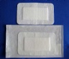 Non woven adhesive dressings